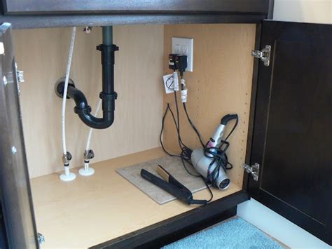 electrical junction box under sink|electrical outlet under sink cabinet.